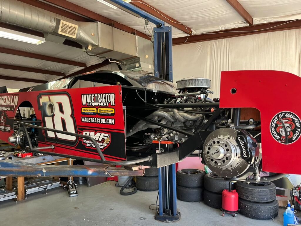 Matthew LaPrade's #18 BMF Shocks & Chassis Modified on the lift in the shop