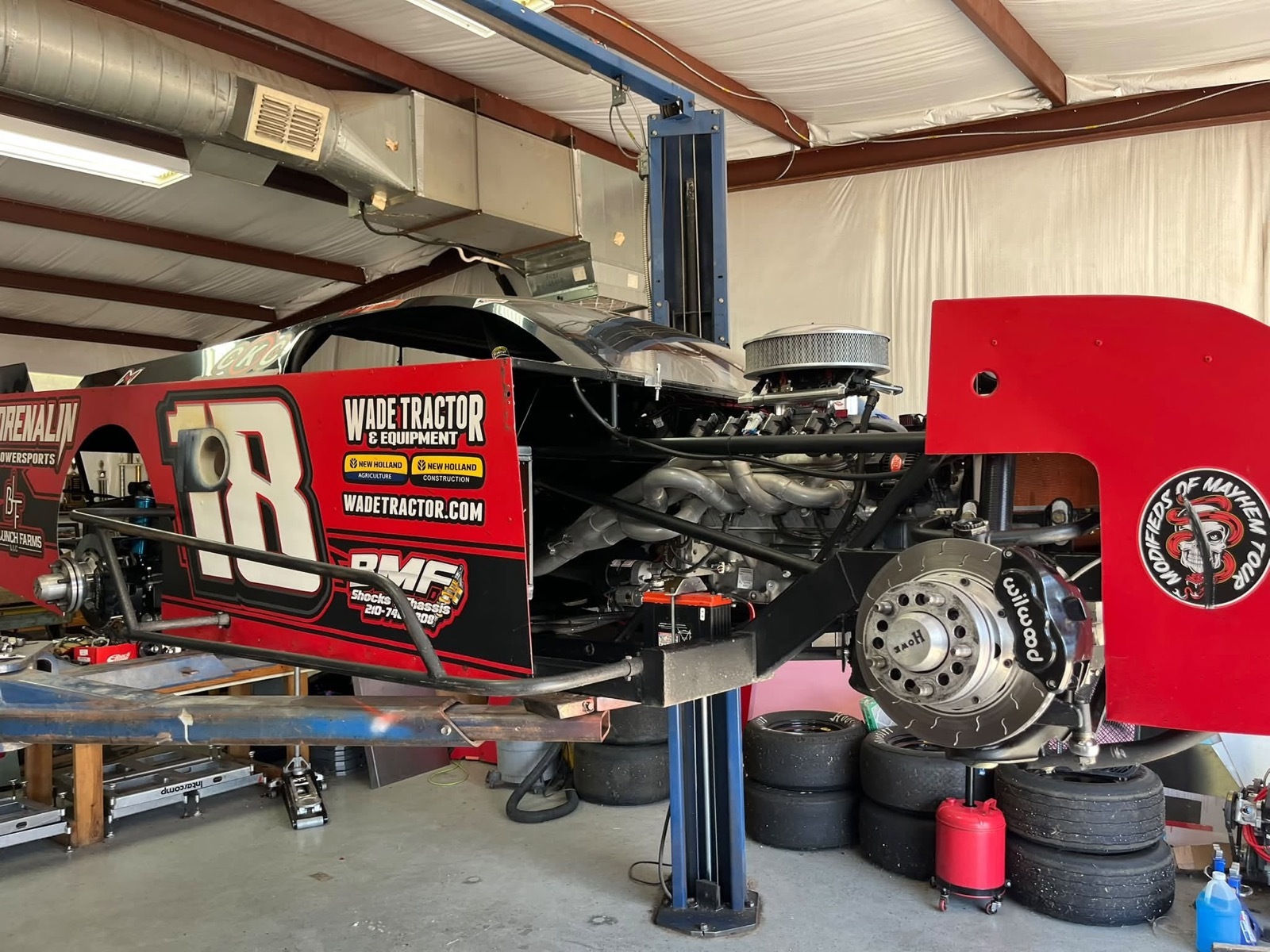 Matthew LaPrade's #18 BMF Shocks & Chassis Modified on the lift in the shop