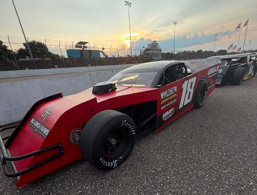 The #18 Modified staged on the apron at sunset at Montgomery Motor Speedway