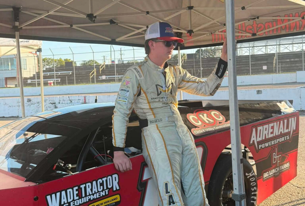 Matthew LaPrade beside his #18 BMF Shocks & Chassis Modified at Montgomery Motor Speedway